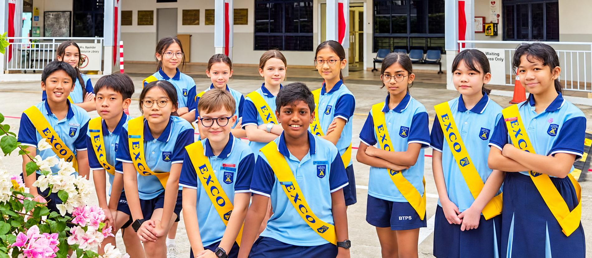Student EXCO members in front of Bukit Timah Primary School, representing student leadership and service while standing together in the school courtyard.
